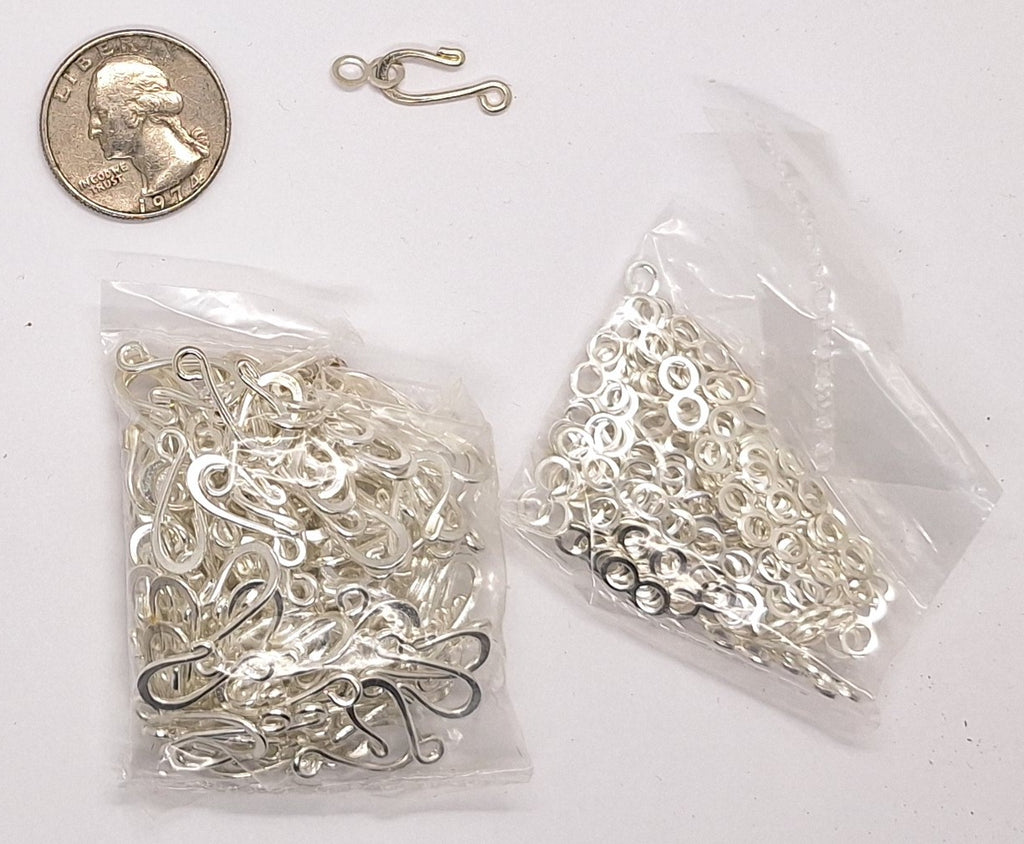 Closeout- Bag of Silver Sew On Hooks. 703q