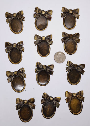 Closeout- 12pcs. of 30x22mm Antique Bronze Cameo Setting with Bow and Hole 862x